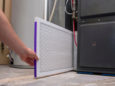 A Los Angeles homeowner easily replaces their furnace filter