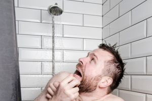 Man running out of hot water during a shower